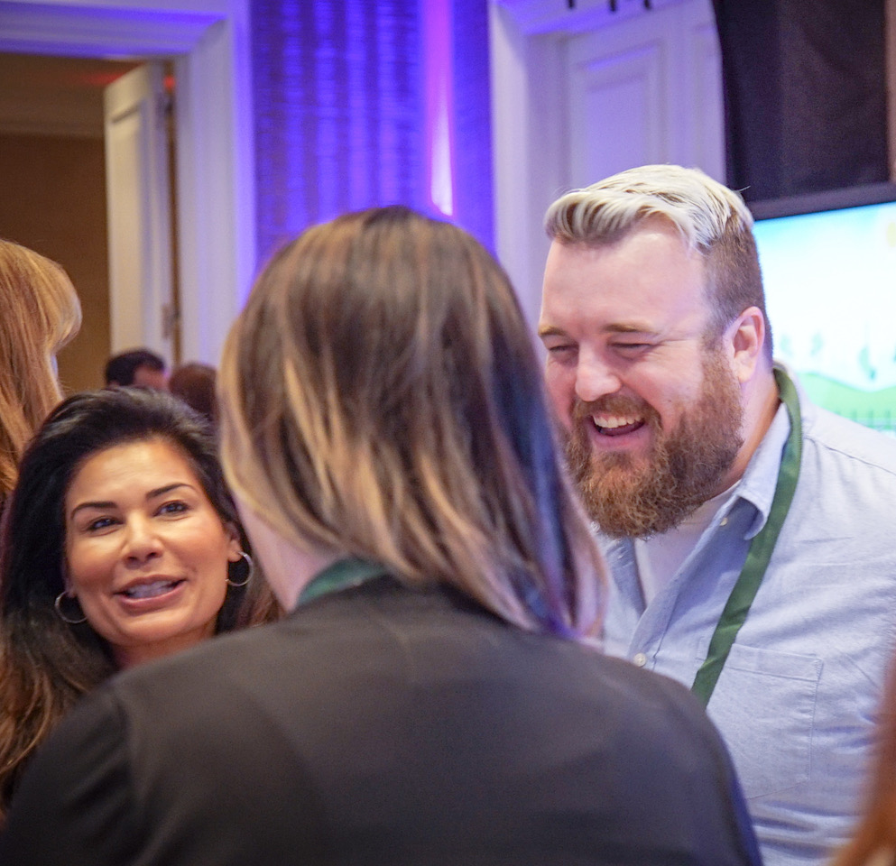 Amazon.com's Justin Boettcher fielding inquiries from Aneela Zaman of Zaman skincare and other attendees at the BeautyX Retail Summit in Dallas, TX.