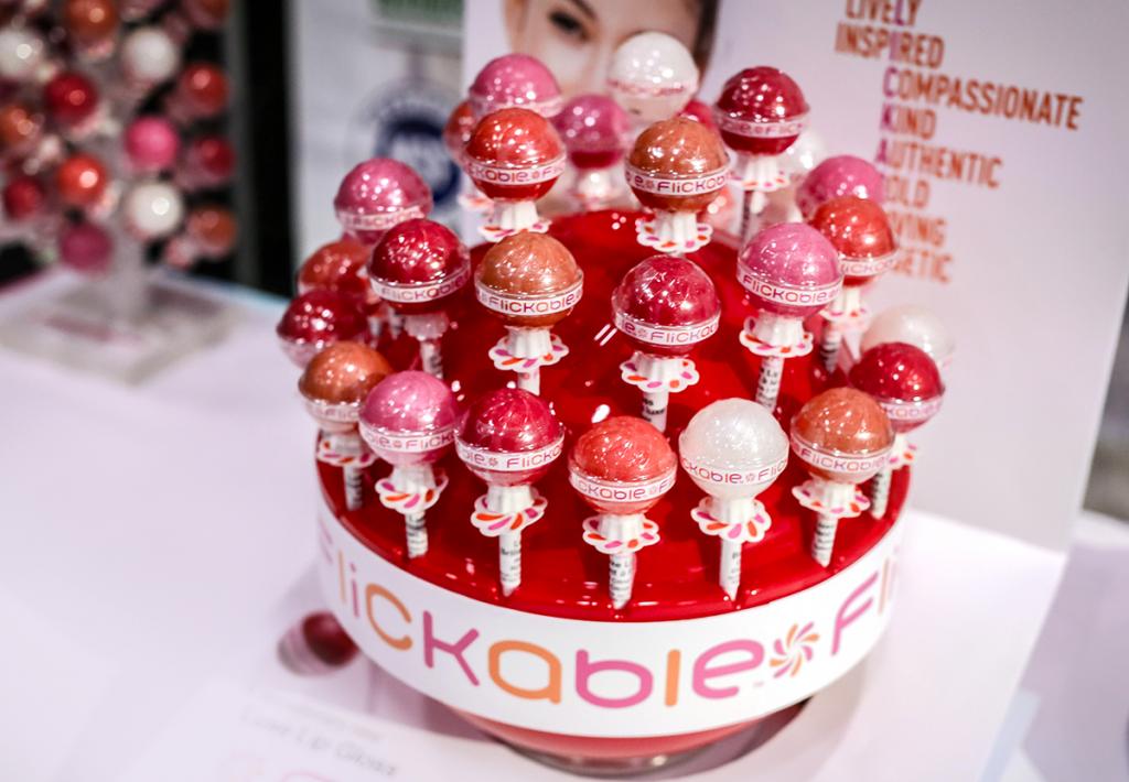 For a lip gloss to stand out in the trending tween and teen market, appealing and innovative packaging, such as Flickable’s lollipop style flavored lip balm, is the way to go. (IBE NY 2018 Biggest Beauty Trends)